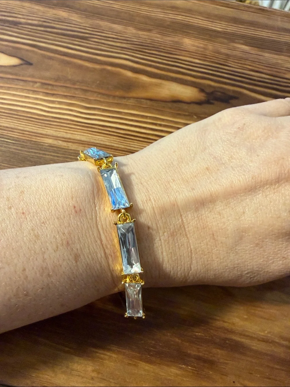 Gold tone with clear Tennis bracelet wiith baguette-cut stones